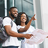 Two tourists holding a map