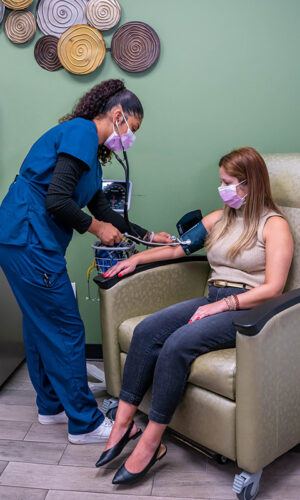 A Swift Health Morrow team member helping a patient