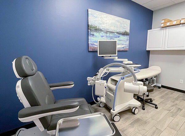 An interior room with medical equipment and beautiful artwork used for patient care at Swift Health Morrow