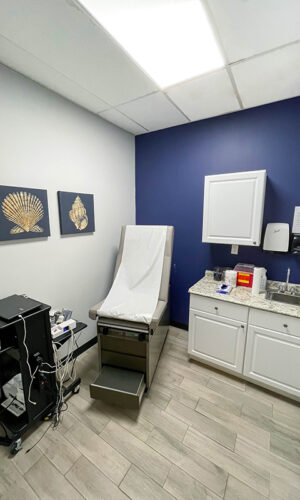 A photo of a Swift Health Morrow interior room with medical equipment and artworks on the walls