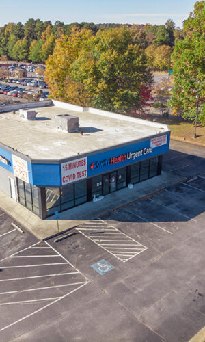 A photo of the Swift Health Morrow exterior showing the front door and parking lot